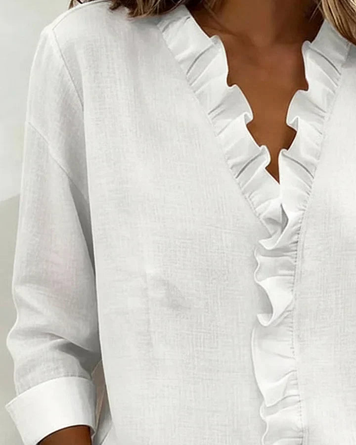 Yvonne | Blusa elegante con escote en V y volantes, mangas largas