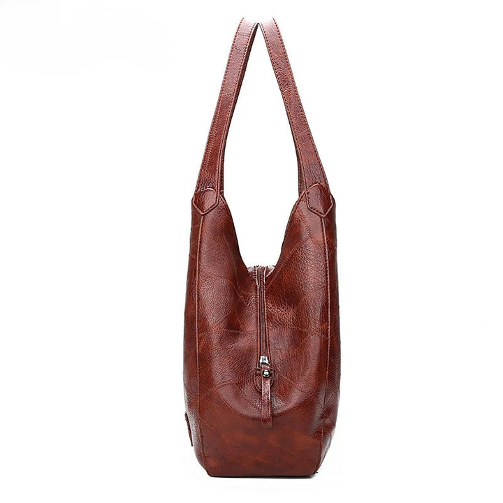 Here are a few options:

- Emilia – bolso de mano vintage
- Bolso de mano vintage Emilia
- Emilia: bolso vintage de mano
- Emilia, cartera de mano vintage
- Bolso vintage de mano “Emilia”