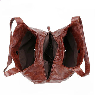Here are a few options:

- Emilia – bolso de mano vintage
- Bolso de mano vintage Emilia
- Emilia: bolso vintage de mano
- Emilia, cartera de mano vintage
- Bolso vintage de mano “Emilia”