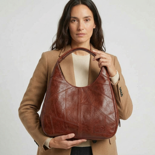Here are a few options:

- Emilia – bolso de mano vintage
- Bolso de mano vintage Emilia
- Emilia: bolso vintage de mano
- Emilia, cartera de mano vintage
- Bolso vintage de mano “Emilia”