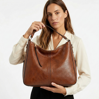 Aquí tienes opciones de título mejoradas:

- Carmela – Bolso de cuero
- Bolso de cuero Carmela
- Carmela – Bolso de cuero elegante
- Carmela – Bolso de cuero clásico
- Carmela – Bolso de cuero para mujer
- Carmela – Bolso de cuero, estilo atemporal
- Carm