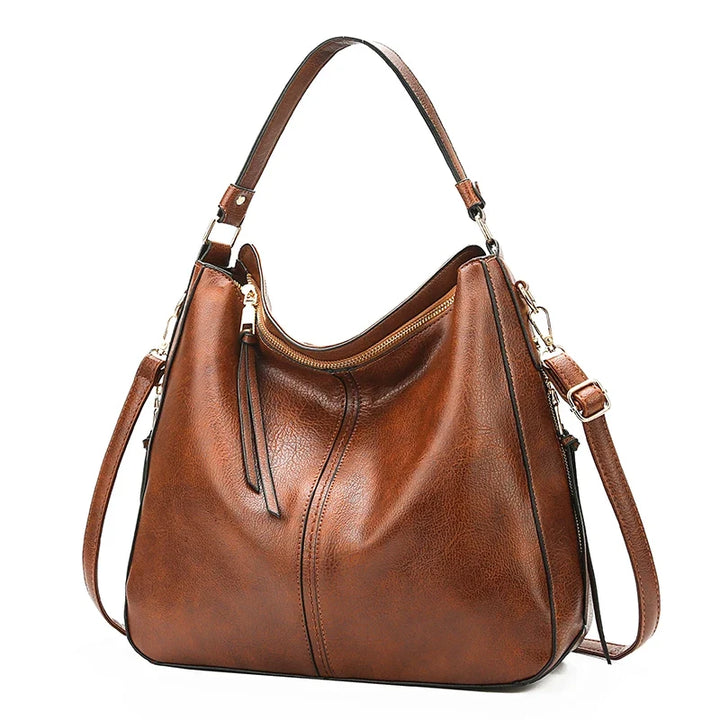 Aquí tienes opciones de título mejoradas:

- Carmela – Bolso de cuero
- Bolso de cuero Carmela
- Carmela – Bolso de cuero elegante
- Carmela – Bolso de cuero clásico
- Carmela – Bolso de cuero para mujer
- Carmela – Bolso de cuero, estilo atemporal
- Carm