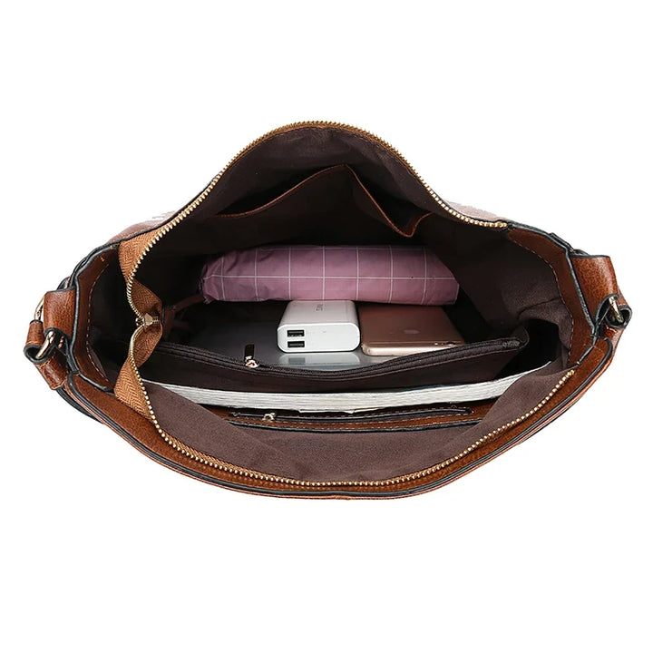 Aquí tienes opciones de título mejoradas:

- Carmela – Bolso de cuero
- Bolso de cuero Carmela
- Carmela – Bolso de cuero elegante
- Carmela – Bolso de cuero clásico
- Carmela – Bolso de cuero para mujer
- Carmela – Bolso de cuero, estilo atemporal
- Carm