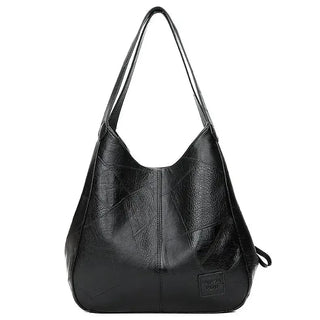 Here are a few options:

- Emilia – bolso de mano vintage
- Bolso de mano vintage Emilia
- Emilia: bolso vintage de mano
- Emilia, cartera de mano vintage
- Bolso vintage de mano “Emilia”