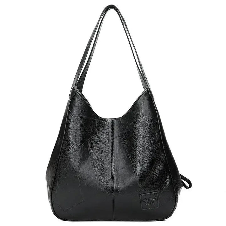 Here are a few options:

- Emilia – bolso de mano vintage
- Bolso de mano vintage Emilia
- Emilia: bolso vintage de mano
- Emilia, cartera de mano vintage
- Bolso vintage de mano “Emilia”