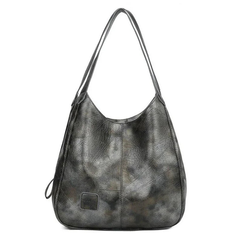 Here are a few options:

- Emilia – bolso de mano vintage
- Bolso de mano vintage Emilia
- Emilia: bolso vintage de mano
- Emilia, cartera de mano vintage
- Bolso vintage de mano “Emilia”