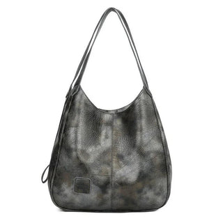 Here are a few options:

- Emilia – bolso de mano vintage
- Bolso de mano vintage Emilia
- Emilia: bolso vintage de mano
- Emilia, cartera de mano vintage
- Bolso vintage de mano “Emilia”