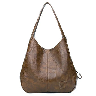 Here are a few options:

- Emilia – bolso de mano vintage
- Bolso de mano vintage Emilia
- Emilia: bolso vintage de mano
- Emilia, cartera de mano vintage
- Bolso vintage de mano “Emilia”