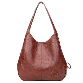 Here are a few options:

- Emilia – bolso de mano vintage
- Bolso de mano vintage Emilia
- Emilia: bolso vintage de mano
- Emilia, cartera de mano vintage
- Bolso vintage de mano “Emilia”