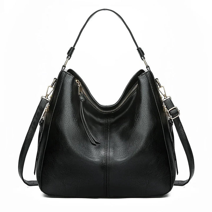 Aquí tienes opciones de título mejoradas:

- Carmela – Bolso de cuero
- Bolso de cuero Carmela
- Carmela – Bolso de cuero elegante
- Carmela – Bolso de cuero clásico
- Carmela – Bolso de cuero para mujer
- Carmela – Bolso de cuero, estilo atemporal
- Carm