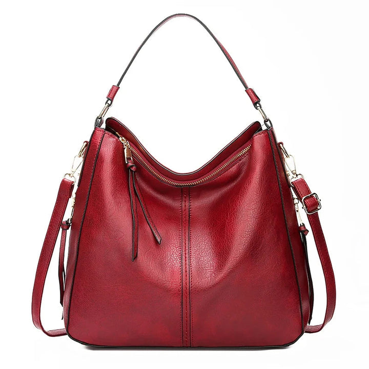 Aquí tienes opciones de título mejoradas:

- Carmela – Bolso de cuero
- Bolso de cuero Carmela
- Carmela – Bolso de cuero elegante
- Carmela – Bolso de cuero clásico
- Carmela – Bolso de cuero para mujer
- Carmela – Bolso de cuero, estilo atemporal
- Carm