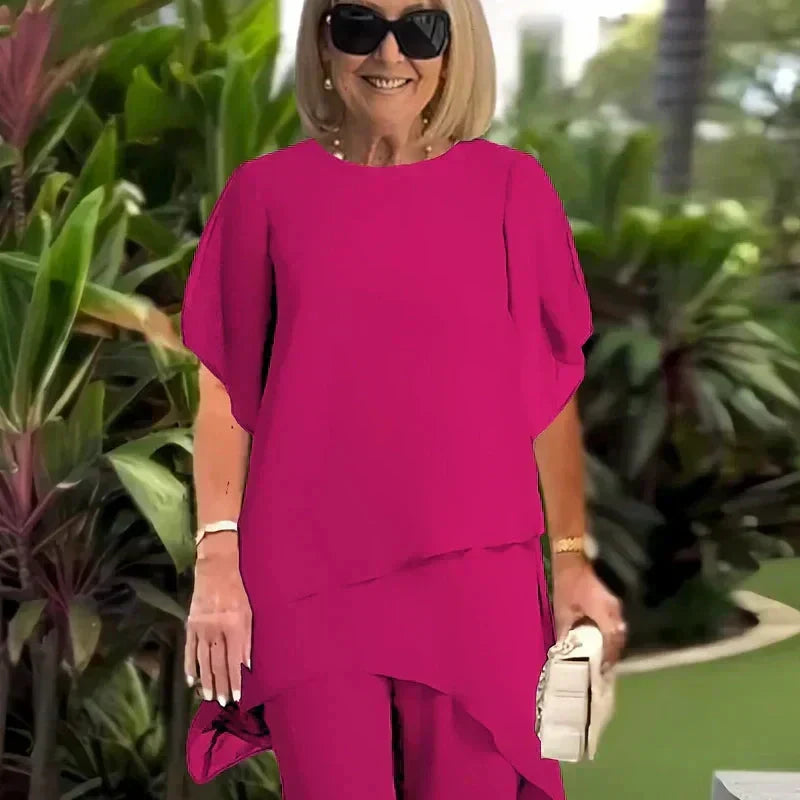 Conjunto compuesto por un top irregular fascinante y pantalones de pierna ancha