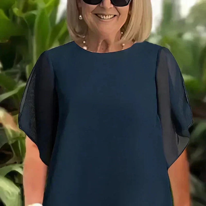 Conjunto compuesto por un top irregular fascinante y pantalones de pierna ancha